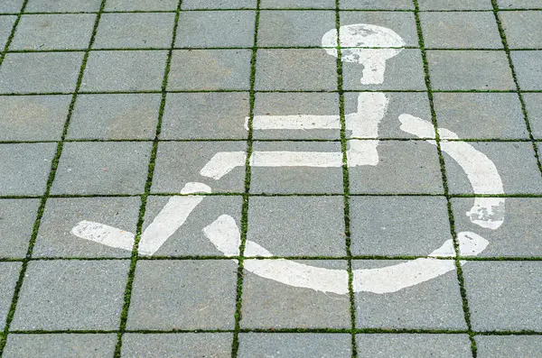Pavement marking indicating a place designed for people with disabilities