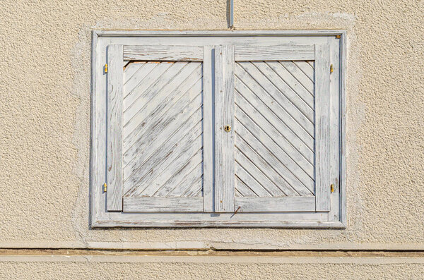 Detail of an old wooden window shutter