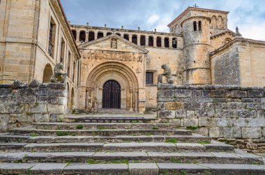View of the Collegiate church and cloister of Santa Juliana in the town of Santillana del Mar, Cantabria, northern Spain, built in the 12th century, in Romanesque style clipart