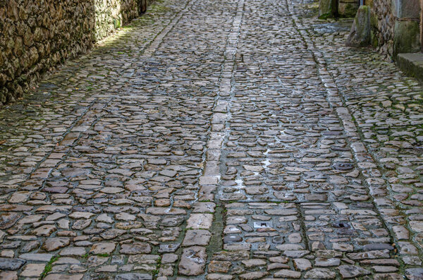 Detail of stone pavement in the village of Santillana del Mar, Cantabria, northern Spain