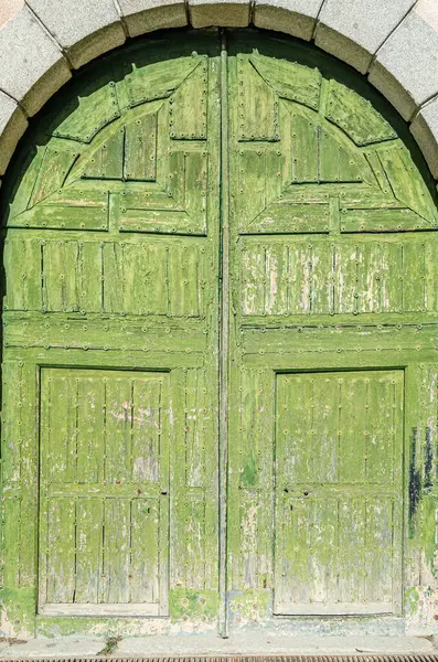 Architectural detail, old wooden grungy green door