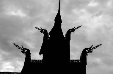 Silhouette of Fantoft Stave Church (Fantoft stavkirke), a reconstruction of Fortun Stave Church, dated bact to 1170, which was moved to Bergen in 1883, destroyed by fire in 1992 and rebuilt in 1997 clipart