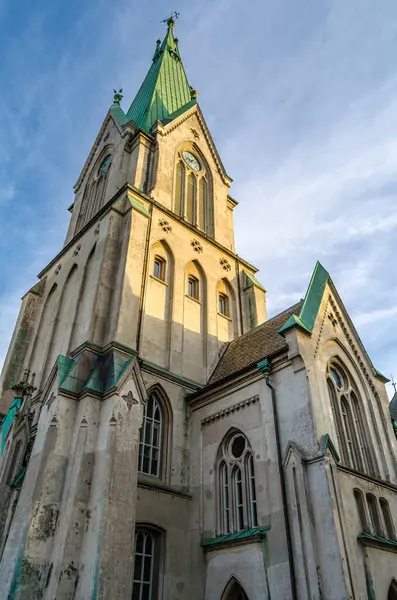 stock image View of Kristiansand Cathedral, Norway. The gray, brick church was built in a Neo-Gothic cruciform design in 1885