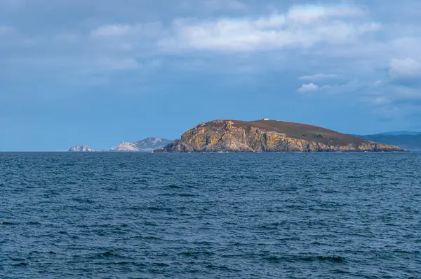 stock image View from the Galician coast (northern Spain) in the town of O Porto de Bares, with Coelleira Island and its lighthouse in the background