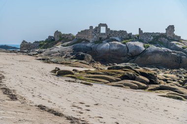 View of the ruins of an old salting factory on the beach of the fishing village of San Cibrao (San Ciprian), Lugo province, Galicia, northwestern Spain clipart