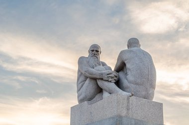 OSLO, NORWAY - JULY 11, 2014: Vigeland installation of sculptures created by sculptorGustav Vigeland from the 1920s until his death in 1943 in Frogner Park, Oslo, Norway clipart