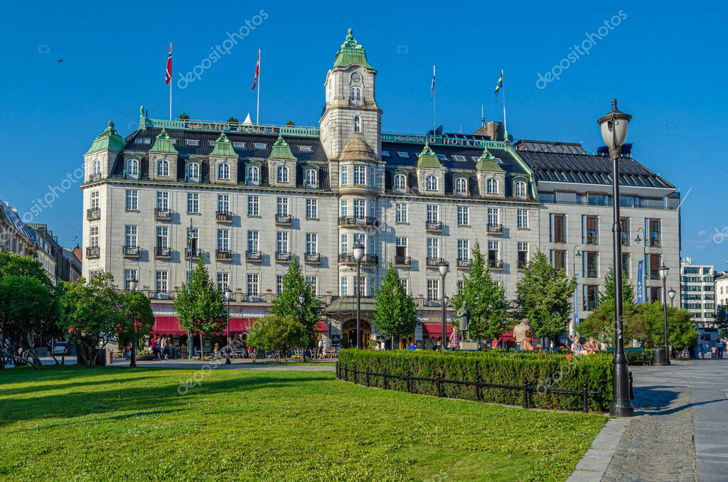 OSLO, NORWAY - JULY 10, 2014: Facade of the Grand Hotel in Oslo, Norway, founded in 1874, is known as the annual venue of the winner of the Nobel Peace Prize