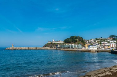 LUARCA, SPAIN - AUGUST 28, 2022: View of the town of Luarca, Asturias, Spain, with the mural created by the Galician association Art for Dent, with the portrait of the Nobel Prize in Medicine, Severo Ochoa clipart