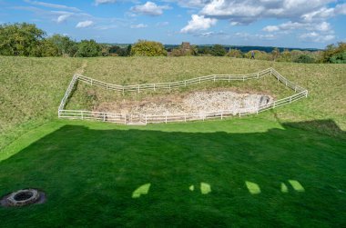 CASTLE RISING, UNITED KINGDOM - OCTOBER 10, 2014: View of the surroundings and earthworks of Castle Rising Castle, a ruined medieval fortification in the village of Castle Rising, Norfolk, England, built in 1138 clipart