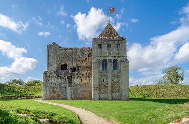 CASTLE RISING, UNITED KINGDOM - OCTOBER 10, 2014: Exterior view of Castle Rising Castle, a ruined medieval fortification in the village of Castle Rising, Norfolk, England, built in 1138 clipart