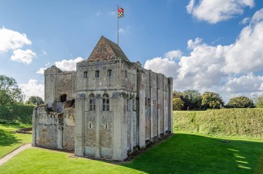 CASTLE RISING, UNITED KINGDOM - OCTOBER 10, 2014: Exterior view of Castle Rising Castle, a ruined medieval fortification in the village of Castle Rising, Norfolk, England, built in 1138 clipart