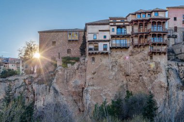 CUENCA, SPAIN - MARCH 28, 2015: The Hanging Houses (Spanish: Casas Colgadas) in Cuenca, Spain. They are so named because part of them has a corbelled roof, or large balconies, jutting out from the high rocky ledge of the Huecar River gorge. The only 