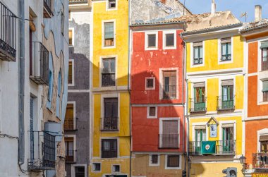 CUENCA, SPAIN - MARCH 29, 2015: Buildings in the old town of Cuenca, Castilla la Mancha, Spain, with their facades decorated during Holy Week