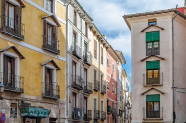 CUENCA, SPAIN - MARCH 29, 2015: Buildings in the old town of Cuenca, Castilla la Mancha, Spain, with their facades decorated during Holy Week