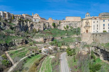 CUENCA, SPAIN - MARCH 28, 2015: Panoramic view of the Huecar Gorge with the town of Cuenca, Spain. In the foreground, the former Convent of San Pablo, since 1993 it houses a state-owned Parador hotel