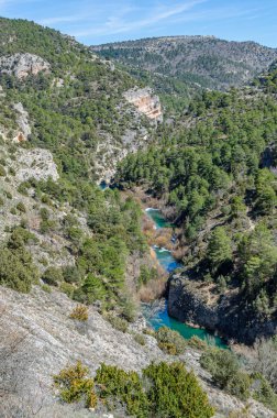 View of the Jucar River in the Serrania de Cuenca Natural Park, Castilla la Mancha, Spain, an example of karst erosion on limestone rock