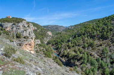 View of the Jucar River in the Serrania de Cuenca Natural Park, Castilla la Mancha, Spain, an example of karst erosion on limestone rock