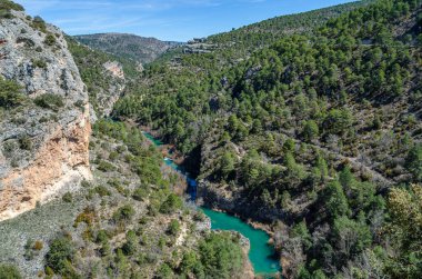 View of the Jucar River in the Serrania de Cuenca Natural Park, Castilla la Mancha, Spain, an example of karst erosion on limestone rock