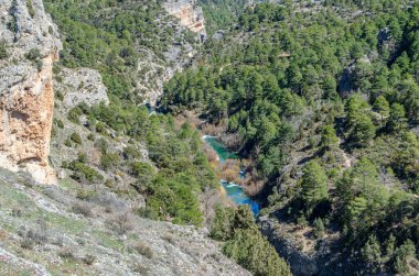 View of the Jucar River in the Serrania de Cuenca Natural Park, Castilla la Mancha, Spain, an example of karst erosion on limestone rock