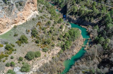 View of the Jucar River in the Serrania de Cuenca Natural Park, Castilla la Mancha, Spain, an example of karst erosion on limestone rock