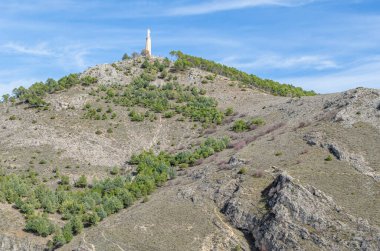 Landscape near the city of Cuenca, Castilla La Mancha, Spain. In the distance, the Monument to the Sacred Heart of Jesus can be seen, a statue built in honor of Jesus of Nazareth atop Socorro Hill