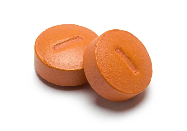 Deux Pilules Rondes Orange Découpées Sur Blanc Photos De Stock Libres De Droits