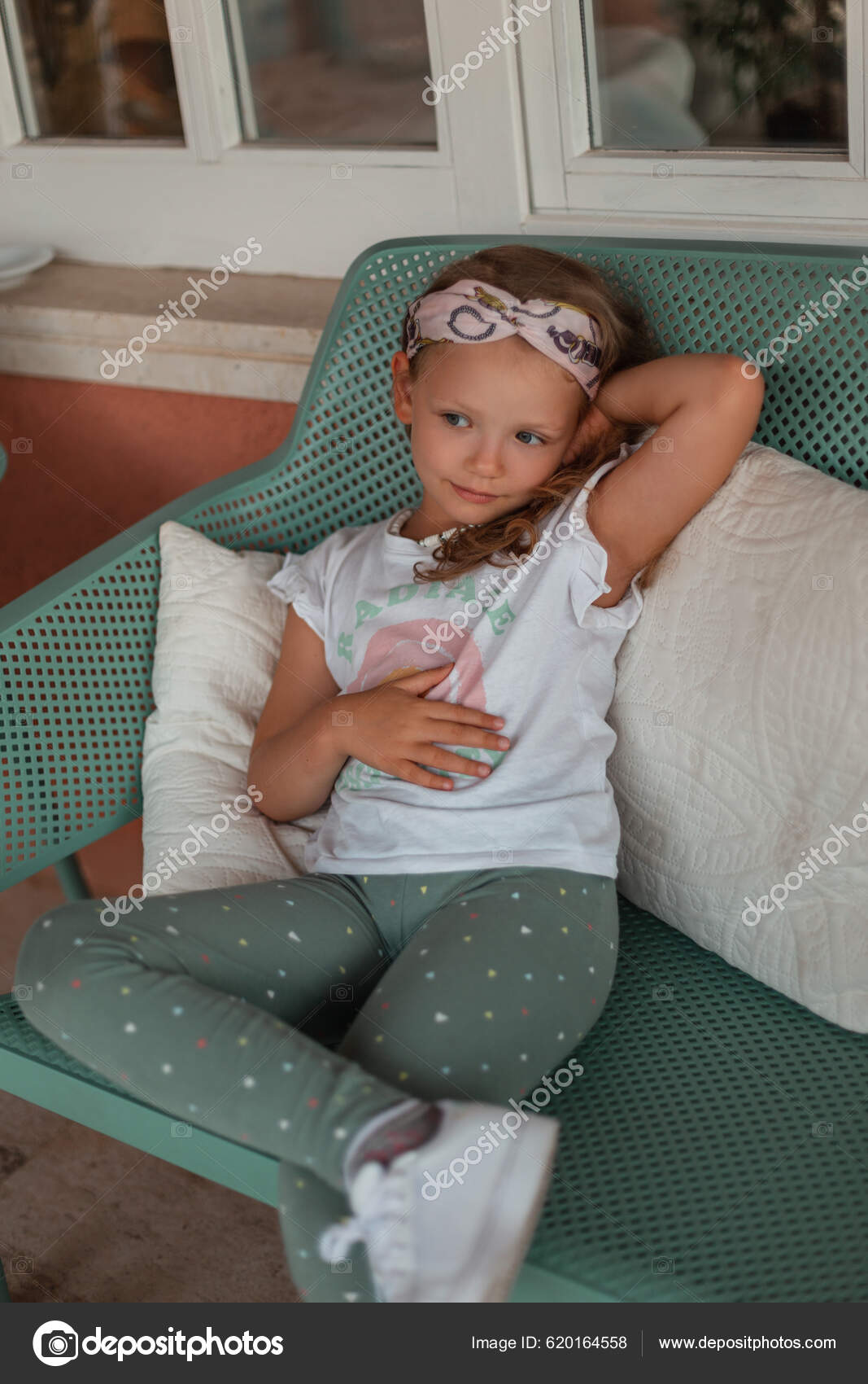 Beautiful little girl child in fashionable summer clothes with a