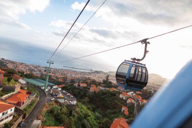Beautiful city of Funchal, Portugal from the height of the funicular cable car. Madeira island by the ocean with a panoramic view of the city