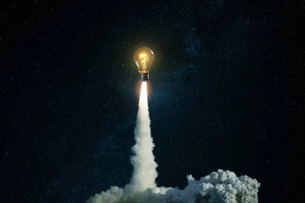 Creative Burning Light Bulb Rocket Blast Clouds Smoke Successfully Takes — Stock Photo, Image
