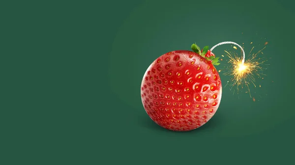 Delicious creative juicy strawberry bomb with wick and sparks burns on a green background, concept. Vitamins and summer time, creative idea.