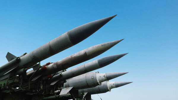 Missiles weapons rockets on a blue sky, concept. War in Israel and Palestine. Armed conflict. Terrorists