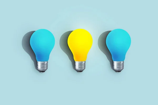 Blue light bulbs with glowing one different idea on blue background. minimal concept. top view. New Creative Idea. One yellow creative light bulb is included. Think differently. Start-up. Education.
