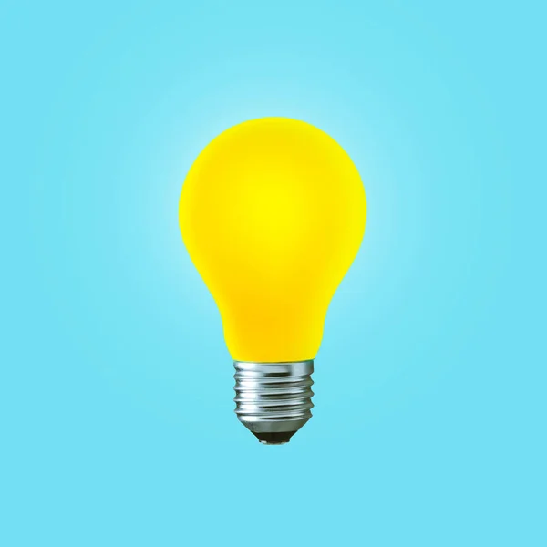 Creative yellow light bulb burns on a blue background, concept. Think differently, creative idea. Light came on. Thinking and start-up. Successful project
