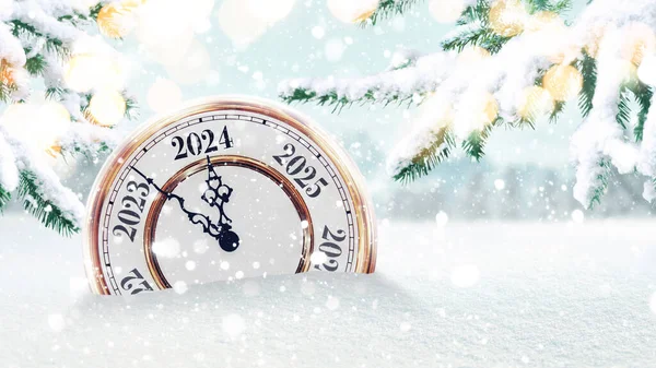 Vintage clock in the snow and points to the new year 2024. Beautiful winter background with fir trees and lights. New Year and Christmas Countdown, creative idea.