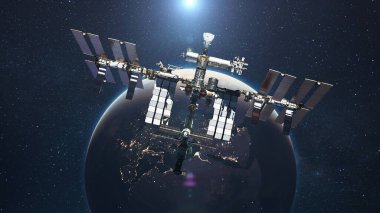 UUİ, mavi gezegen Dünya 'nın arka planında güneş ışığıyla uçuyor. Uzay görevi ve uzay keşfi