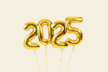 Bej arka planda uçan 2025 yılbaşı kutlamaları. Bağbozumu numarası 2025.