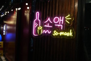 Bangkok, Thailand - November 26, 2024: Somaek soju neonsign, neon sign alcoholic drink at night clipart