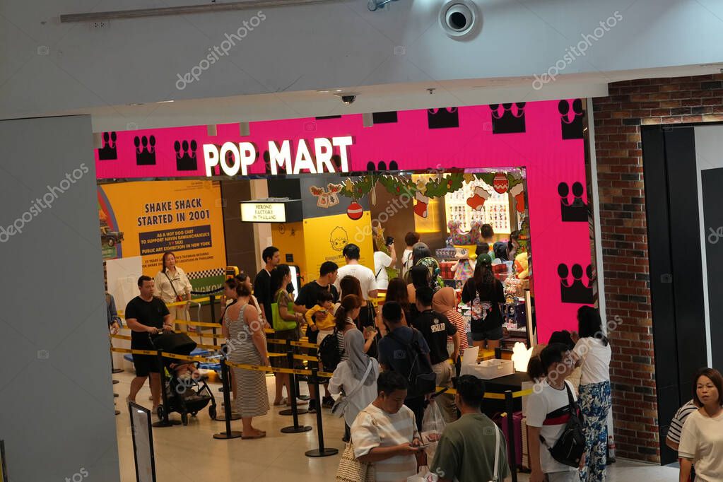 Bangkok, Thailand - November 26, 2024: People waiting in line to purchase toys at POP MART, central world Bangkok. The company is known for selling collectable designer toys.