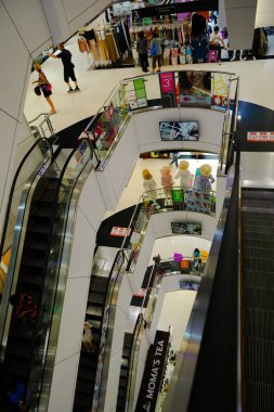 Bangkok, Thailand, Nov 21, 2024: Top view floors from escalator in Platinum shopping mall, with local and tourist walking clipart