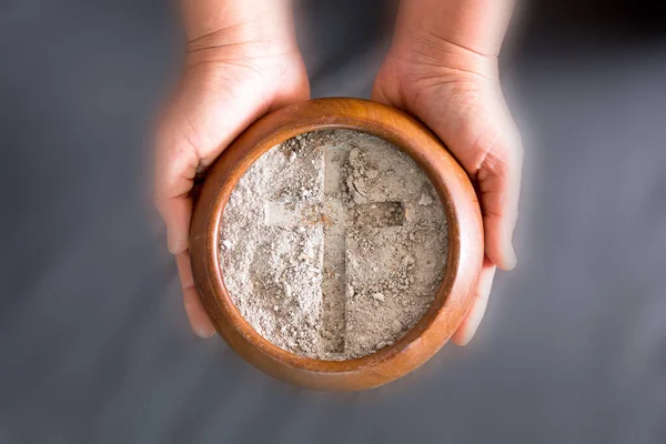 Ashes in hand are prepared for Christian festival of apostles. dust symbol of religion, sacrifice, redemption, Jesus Christ, ash wednesday, lent, Good Friday, Easter with Church is devoted to fasting