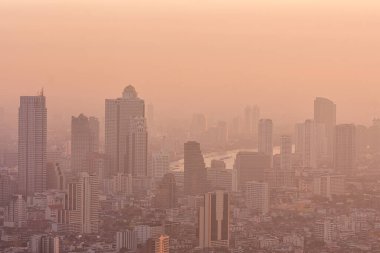 Bad air pollution in City. PM 2.5 dust in Bangkok or center city, Capital city are covered by heavy smog, Misty morning and sunrise in downtown with bad air pollution, Place to risk of cancer,Thailand