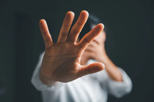 Stock image Stop violence against women concept, international women's day. Female hand raised in fear and stop sexual harassment. Women are depressed by bullying and abuse. family threat