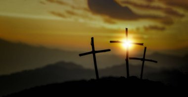 Crucifixion Of Jesus Christ - Cross At Sunset. The concept of the resurrection of Jesus in Christianity. Crucifixion on Calvary or Golgotha hills in holy bible. clipart
