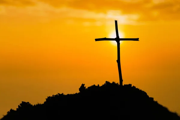 stock image Crucifixion Of Jesus Christ - Cross At Sunset. The concept of the resurrection of Jesus in Christianity. Crucifixion on Calvary or Golgotha hills in holy bible.