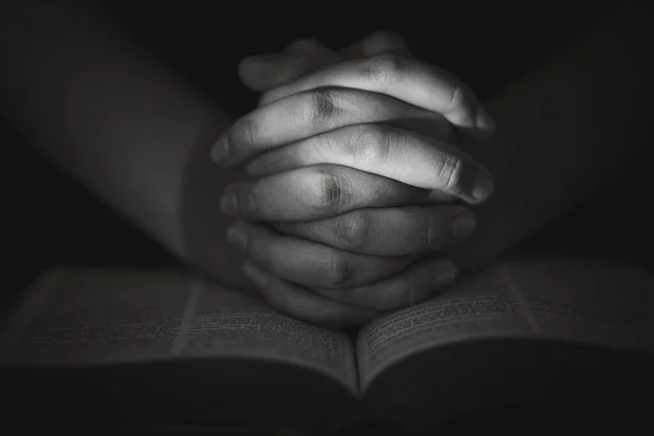 Young woman person hand praying on holy bible with study. Adult female christian reading book in church. Girl learning religion spirituality with pray to god. concept of student education faith.