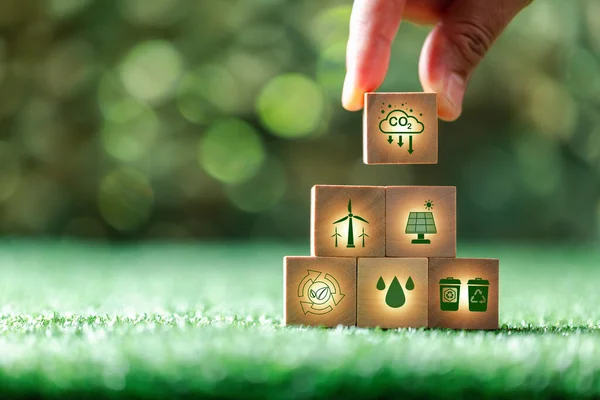 stock image Companies are targeting net zero greenhouse gas emissions. Carbon credit concept.Tradable certificate to drive industry in direction of low emissions in efficiency cost.Wooden cubes with decrease CO2