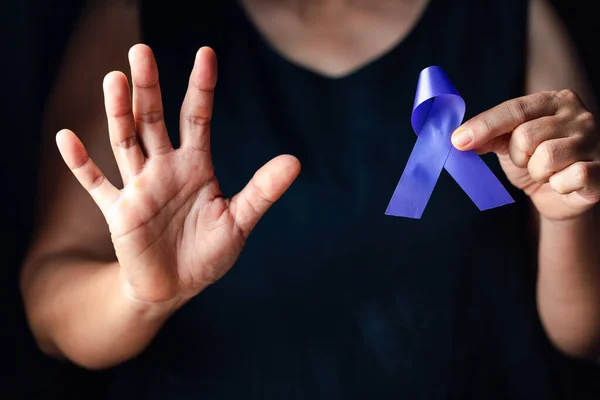 stock image Hands holding purple ribbon symbol of Alzheimer disease, world Lupus. Day and world cancer day. Pancreatic cancer, fibromyalgia awareness, Epilepsy awareness, domestic violence awareness.