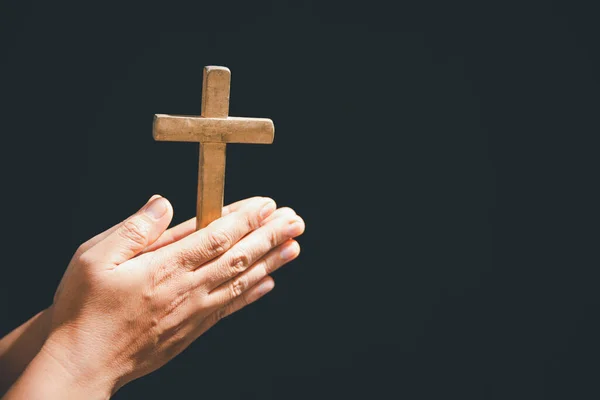 stock image Christian life crisis prayer to god. Woman pray for god blessing to wishing have a better life. Female hands praying to god with crucifix cross. begging for forgiveness and believe in goodness.