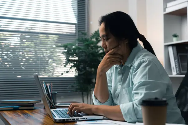 Stress business woman person from hard work, depression in office. Tired and anxious employee female with unhappy at problem job. young businesswoman sitting sad front of laptop computer on desk.