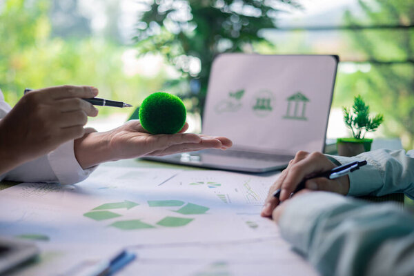 Business meeting on sustainable real estate development. real estate, sustainable development, business meeting, green building, eco-friendly, architecture, planning, construction, investment.